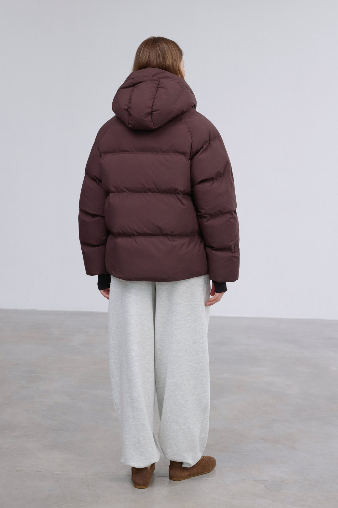 Full-length shot presenting the stylish loose-fit cut and minimalist design.