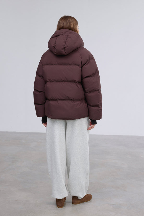 Full-length shot presenting the stylish loose-fit cut and minimalist design.