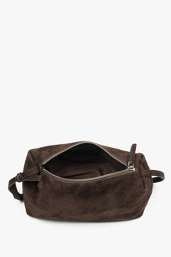 Close-up of soft dark brown natural velour texture.