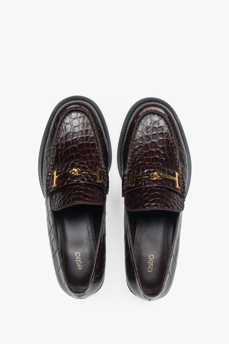 Women’s loafers Estro, dark brown, made of patent natural leather, with a decorative buckle.