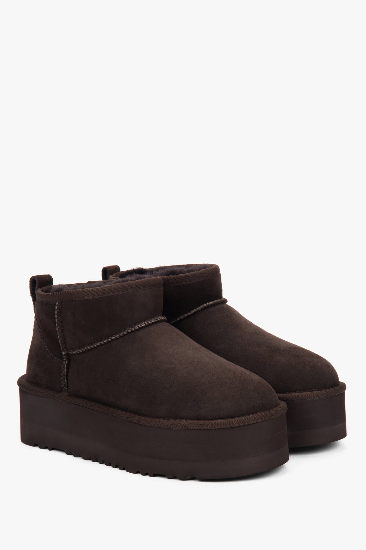 Dark brown women’s snow boots with a thick sole, made of genuine velour with fur lining.