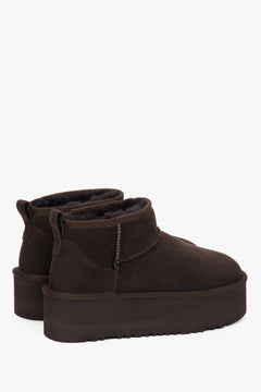On a thick sole — dark brown women’s snow boots made of genuine velour with fur lining, Estro.