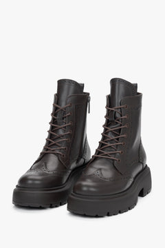 Dark brown natural leather ankle boots featuring folk-style laser perforation details, Estro.