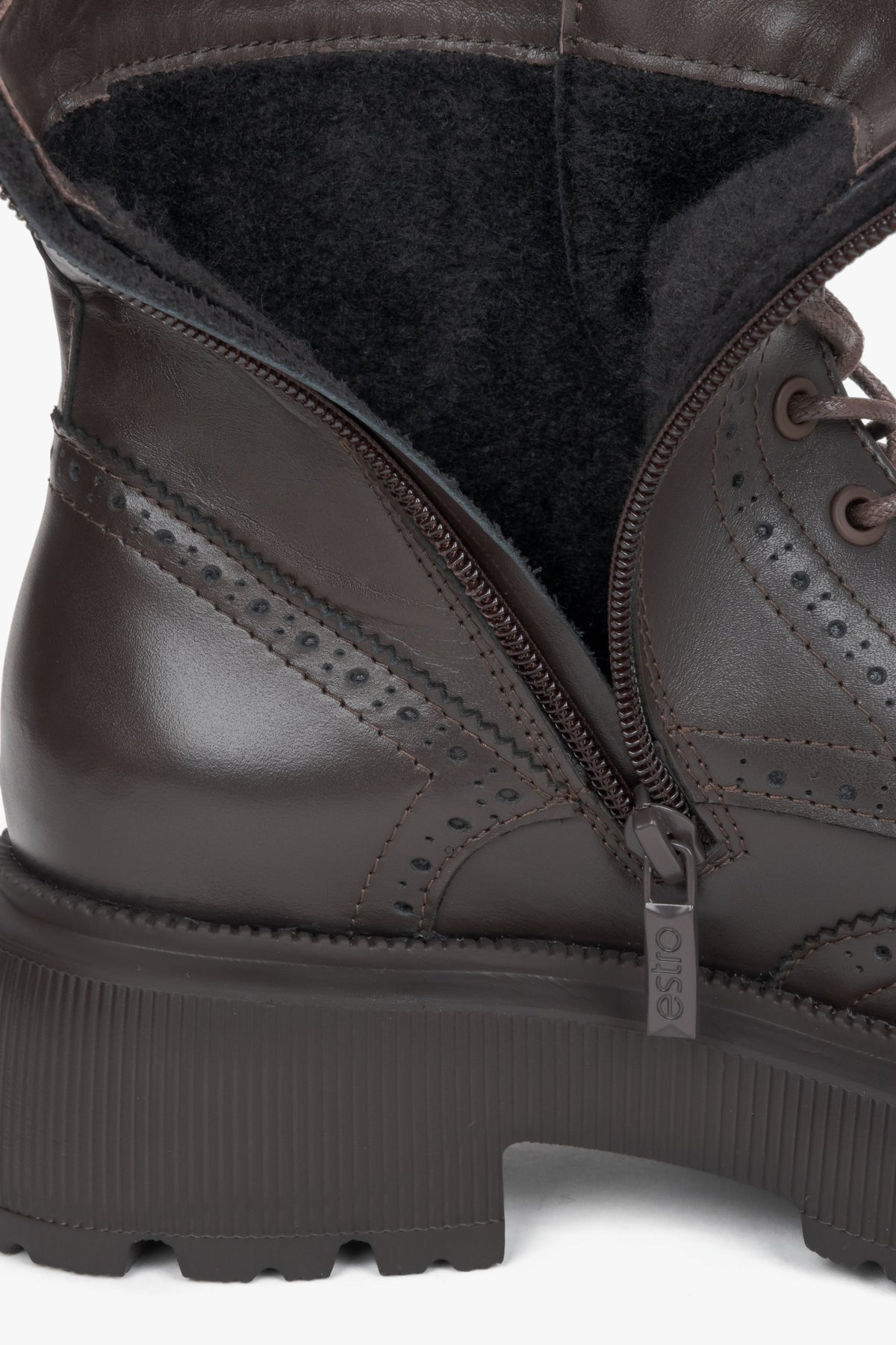 Women's dark brown genuine leather boots Estro - close-up view focusing on the rich leather finish and intricate folk perforations.
