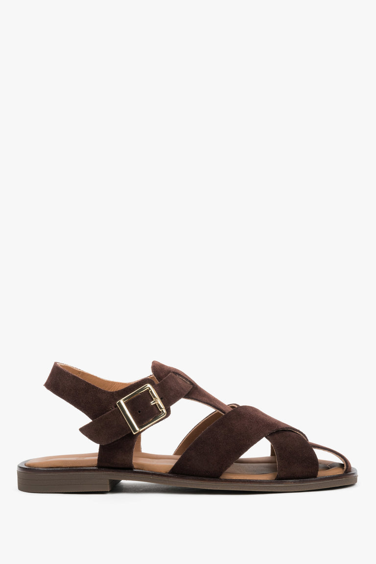 Dark brown women’s Estro sandals made of natural suede with crisscross straps and a buckle.