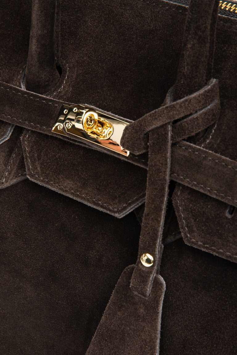 Gold-tone hardware and precise stitching highlight the luxurious craftsmanship and Italian attention to detail.