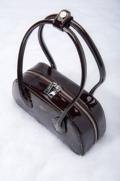 Dark brown glossy leather shoulder bag with a compact, elegant design.