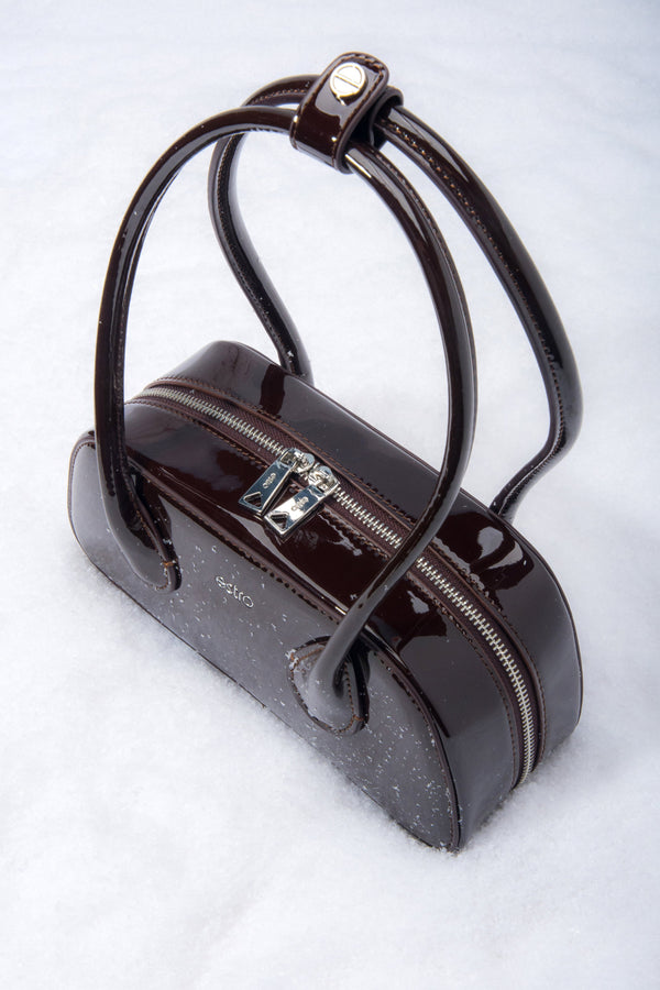 Dark brown glossy leather shoulder bag with a compact, elegant design.