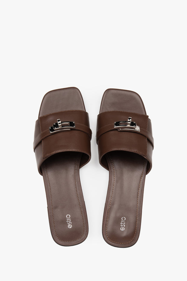 Classic dark brown Estro women's slide sandals, refreshingly accented with a silver embellishment — perfect for summer and comfortable thanks to the flat sole.