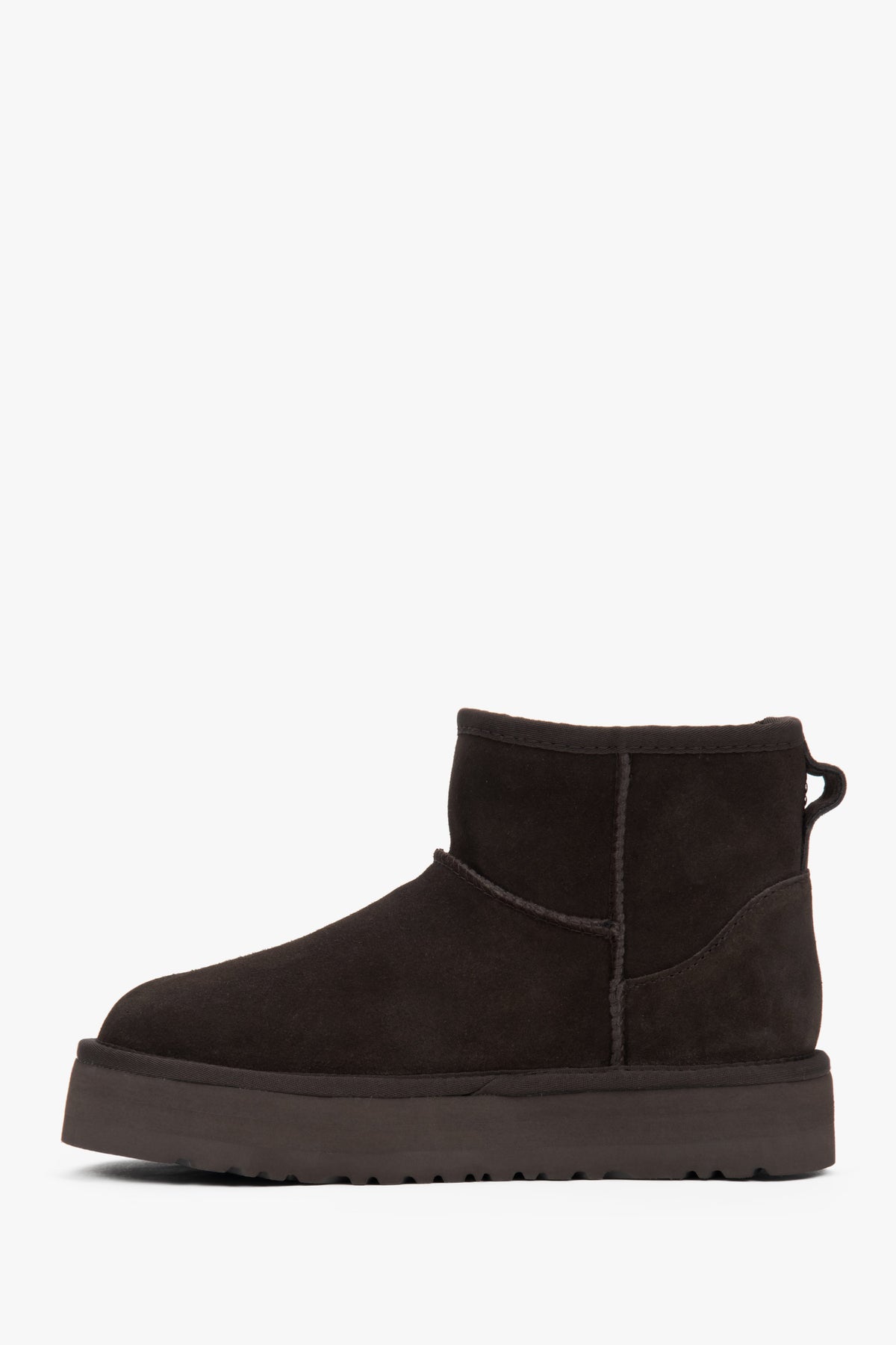 Warm and stylish women's snow boots made of dark brown velour with a fur-lined interior.
