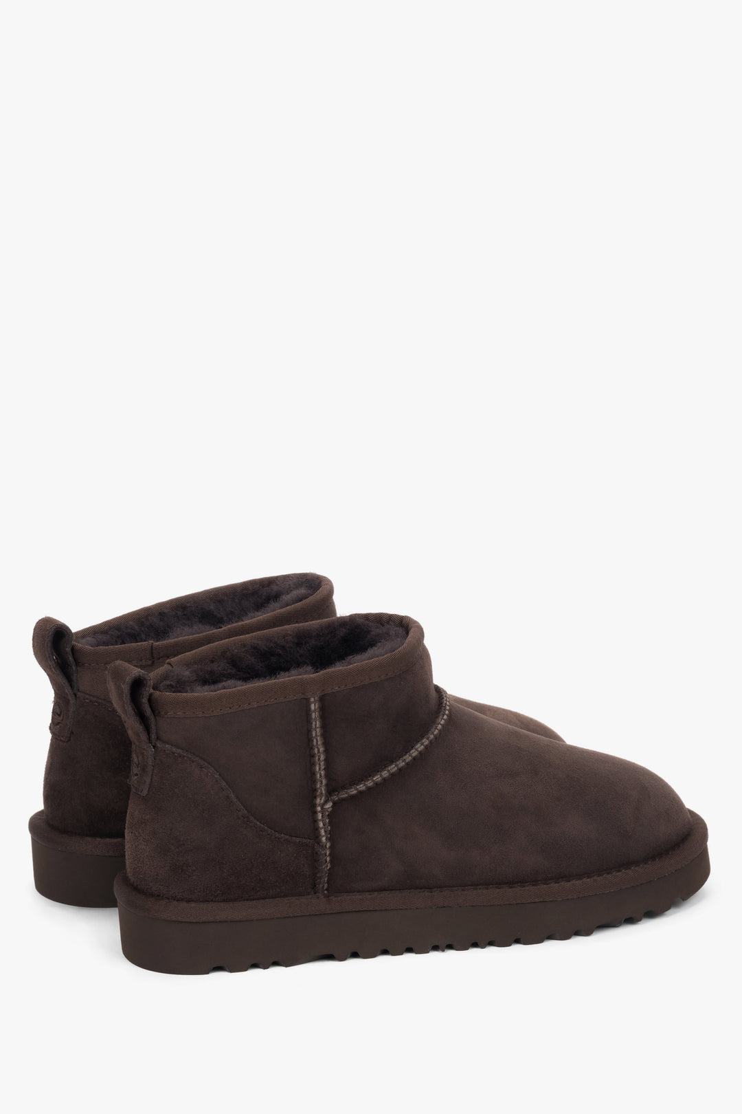 Dark brown velour snow boots with a snug fur interior — a winter must-have from Estro.