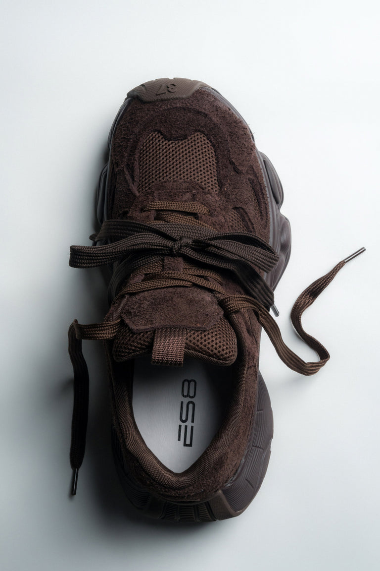 Dark brown women's velour sneakers by Estro – a clean side profile showing the bold, geometric platform sole.