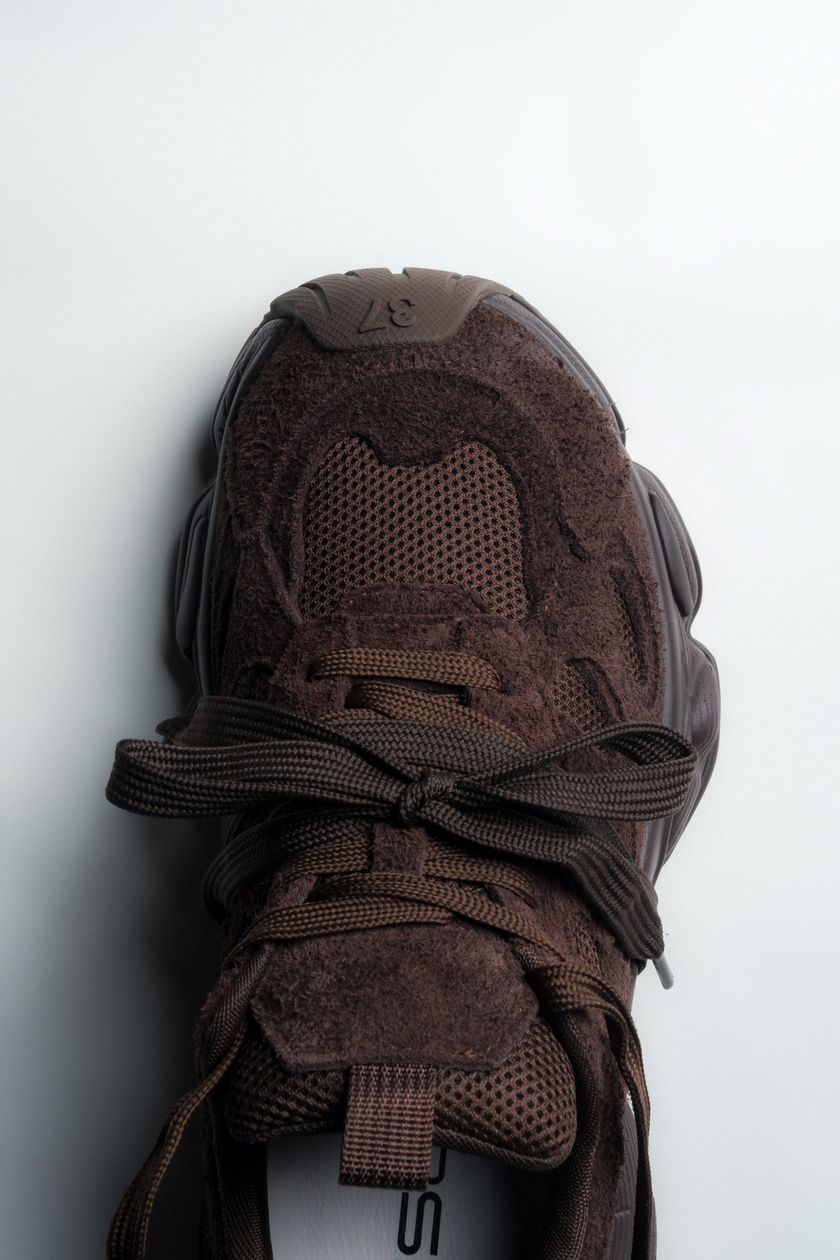 Women's espresso-brown velour sneakers – back view highlighting the stable platform heel structure.