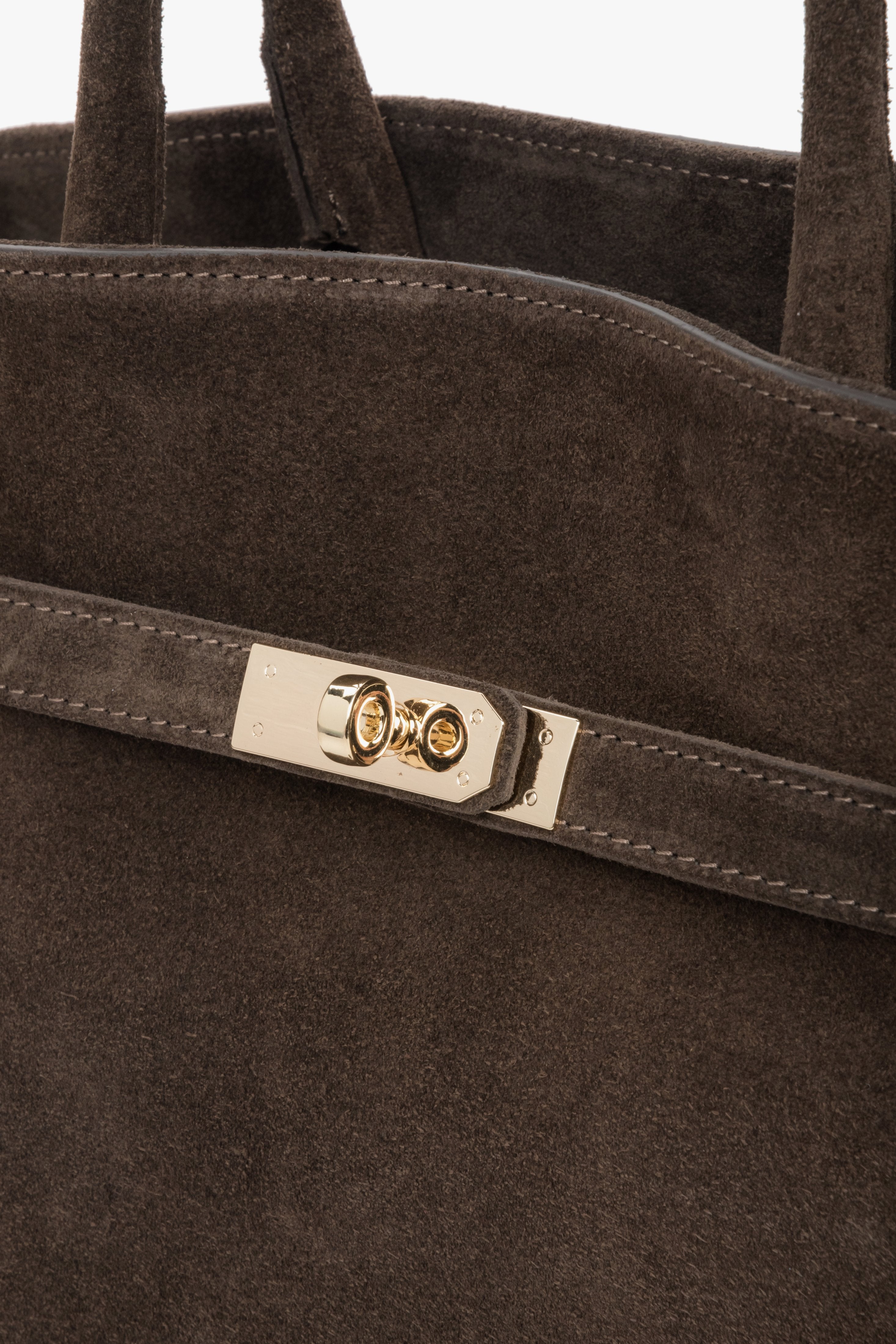 A structured tote with refined details — gold-tone zipper and contrasting handles add a touch of sophistication.