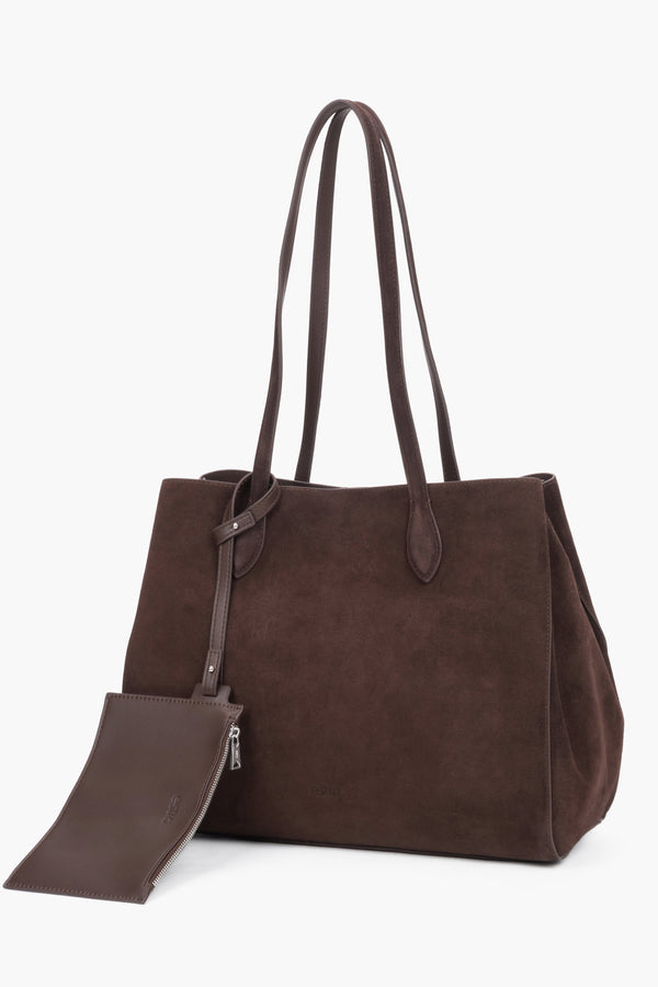 Women's dark brown Estro shopper bag made of natural velour, featuring a minimalist front design and long, comfortable handles for shoulder carrying.