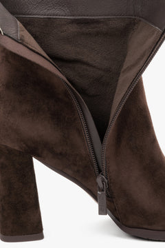 Made of genuine velour, dark brown women’s ankle boots with block heel Estro.