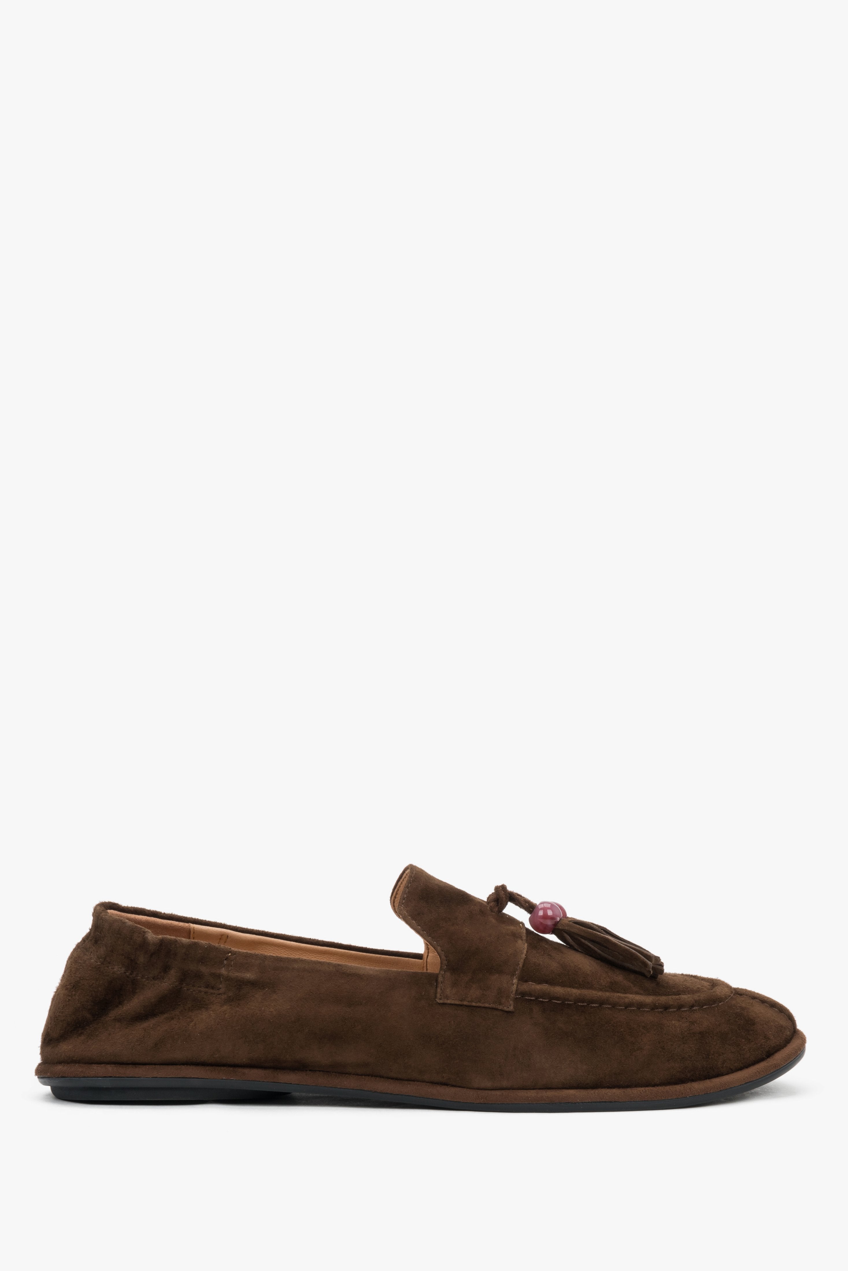 A profile shot of the women's dark brown loafers highlighting the ultra-flat, flexible barefoot sole and the soft upper construction.