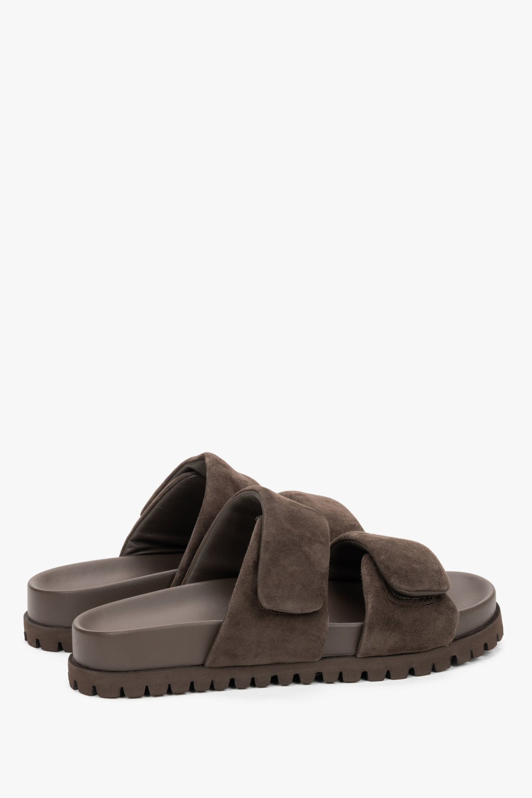 Angled view of women's dark brown velour mules with rubber sole