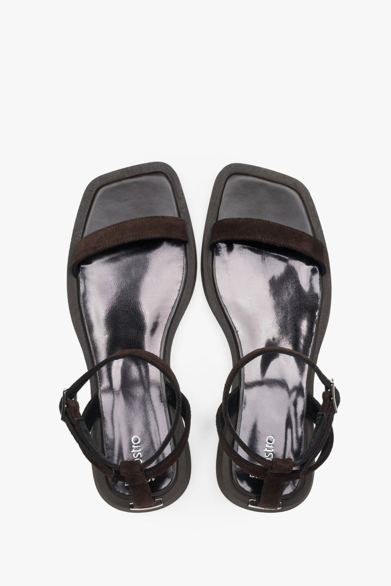 Top view of women’s dark brown flat sandals with slim velour straps.