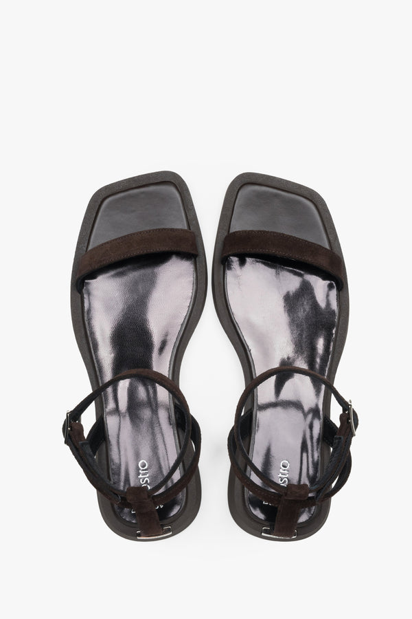 Top view of women’s dark brown flat sandals with slim velour straps.