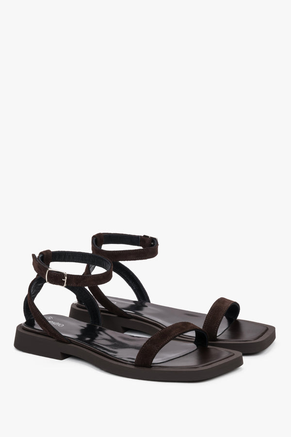 Detail view of the thin straps and soft dark brown velour on Estro sandals.