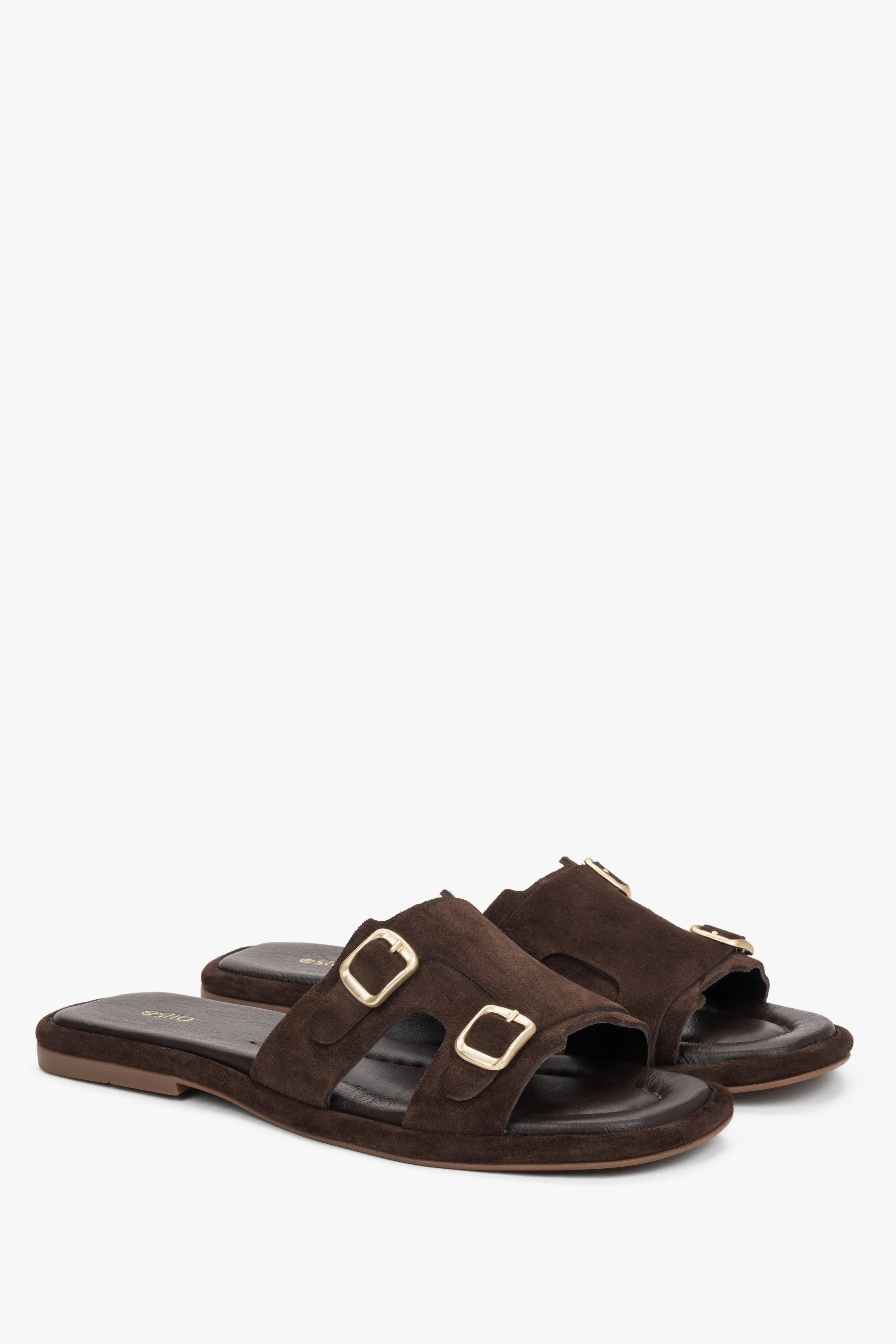 A close-up shot highlighting the smooth, premium chocolate brown leather texture and the polished finish of the subtle gold-tone hardware.
