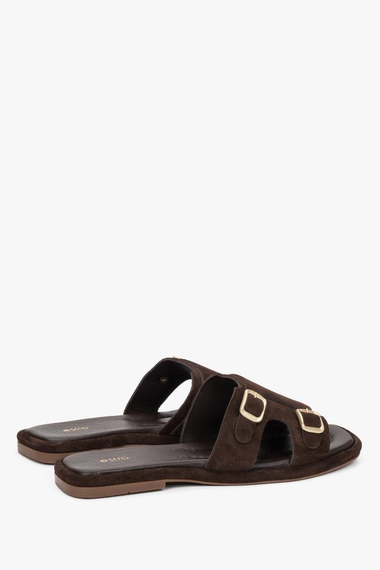 The back of the shoe showing the clean cuts, precise stitching, and stable low platform profile of these luxury vacation slides.