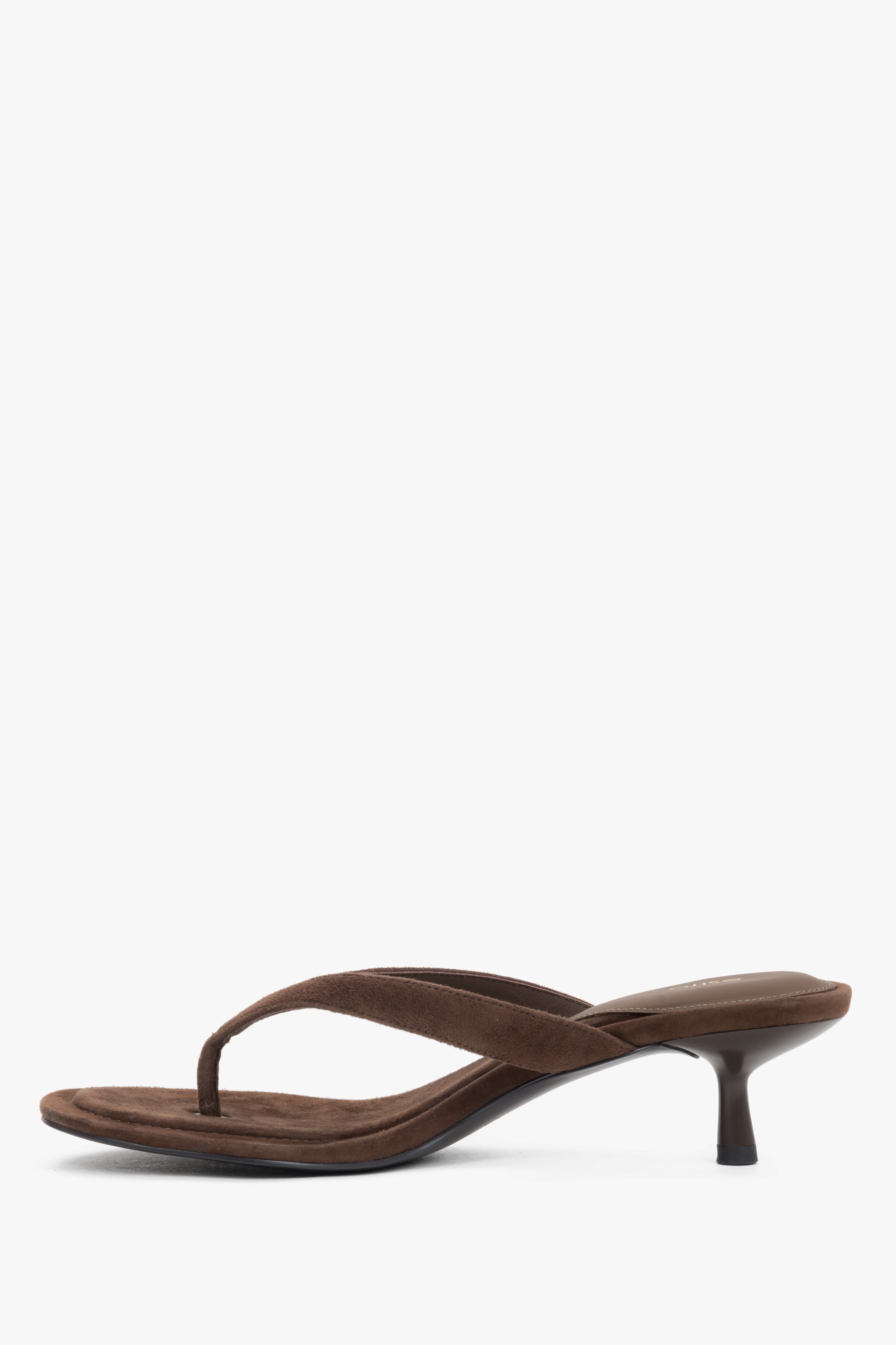 View of the soft colored stripes on Estro's dark brown mules from the left side