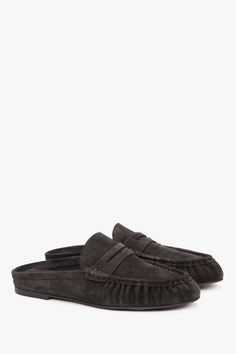Dark brown suede Estro mules, showcasing an elegant backless silhouette and meticulously crafted stitching on the upper for a refined, sophisticated look.