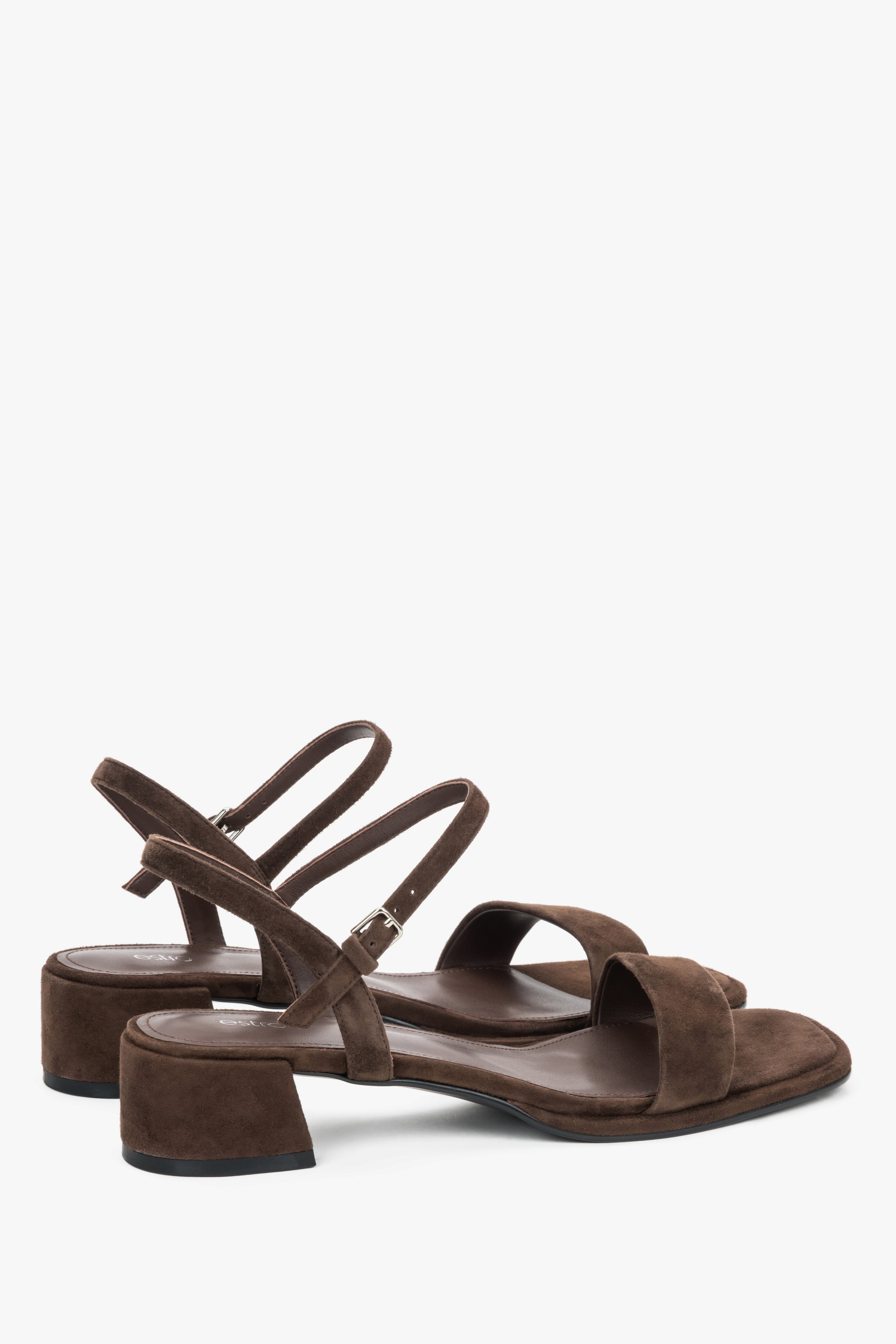 Estro dark brown sandals featuring a stable square heel and adjustable strap.