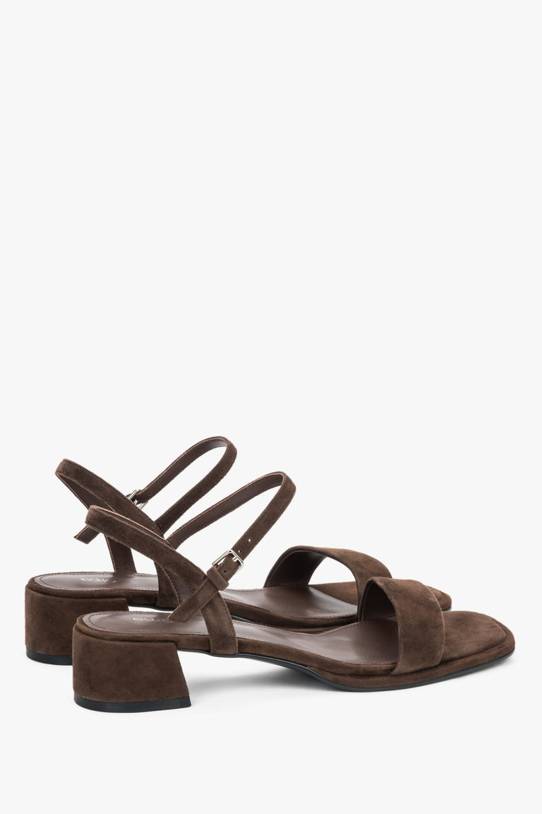 Estro dark brown sandals featuring a stable square heel and adjustable strap.