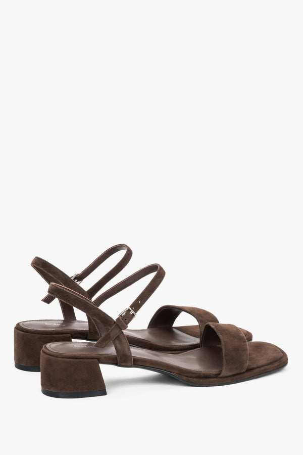 Estro dark brown sandals featuring a stable square heel and adjustable strap.