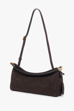 Compact dark brown bag featuring one main compartment and an interior pocket.