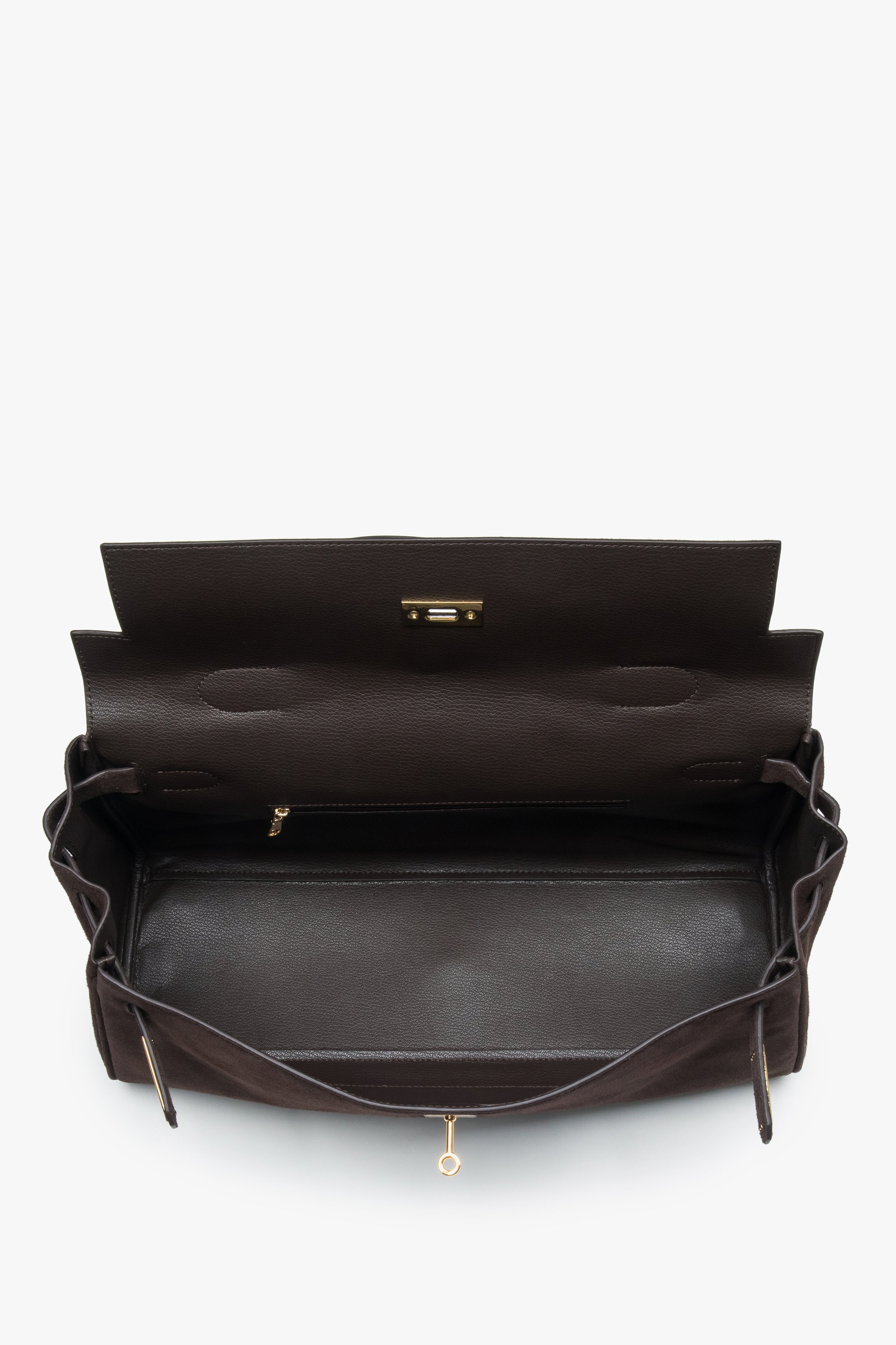 Made of genuine velour — a dark brown women’s shoulder bag with gold hardware from Estro.