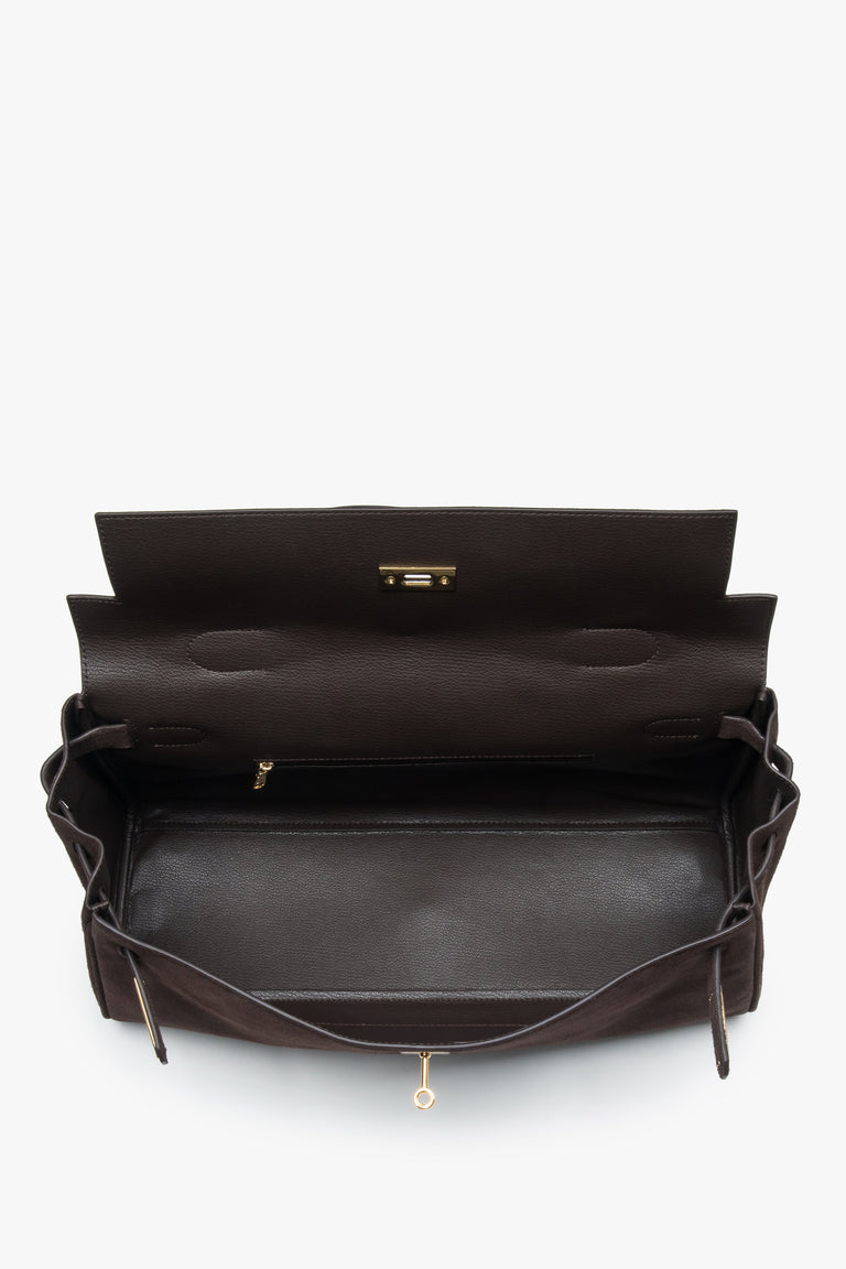 Made of genuine velour — a dark brown women’s shoulder bag with gold hardware from Estro.