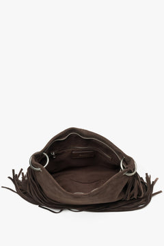 A top-down shot showing the spacious interior with a textile lining, three separate compartments, and smaller zippered pockets.