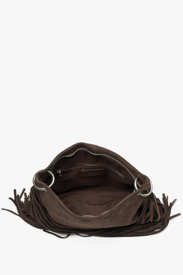 A top-down shot showing the spacious interior with a textile lining, three separate compartments, and smaller zippered pockets.