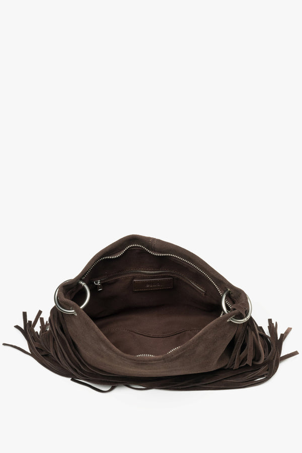 A top-down shot showing the spacious interior with a textile lining, three separate compartments, and smaller zippered pockets.