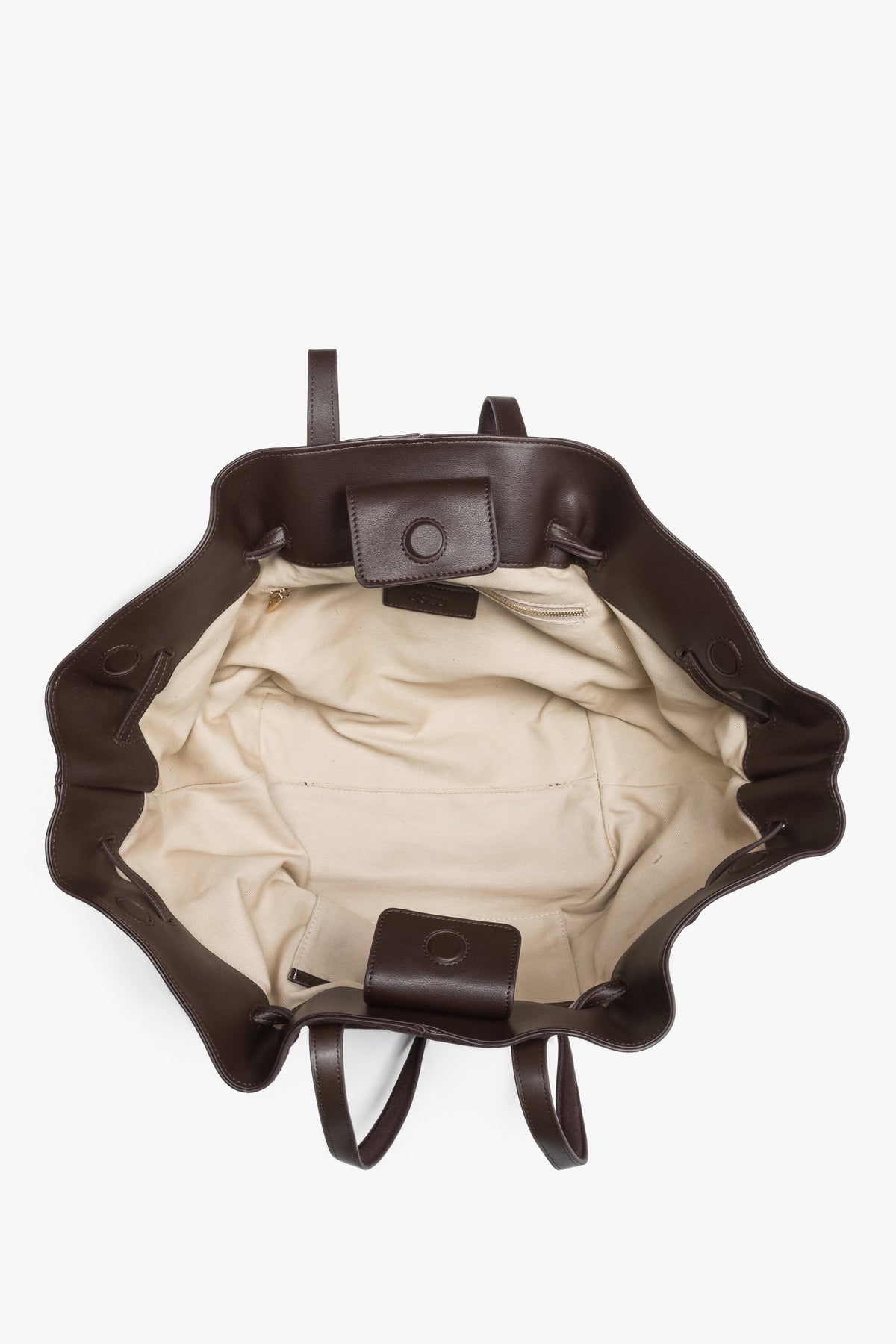 Spacious interior with one main compartment and two pockets keeps essentials organized.