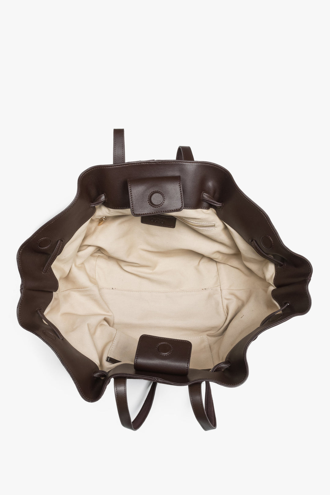 Spacious interior with one main compartment and two pockets keeps essentials organized.