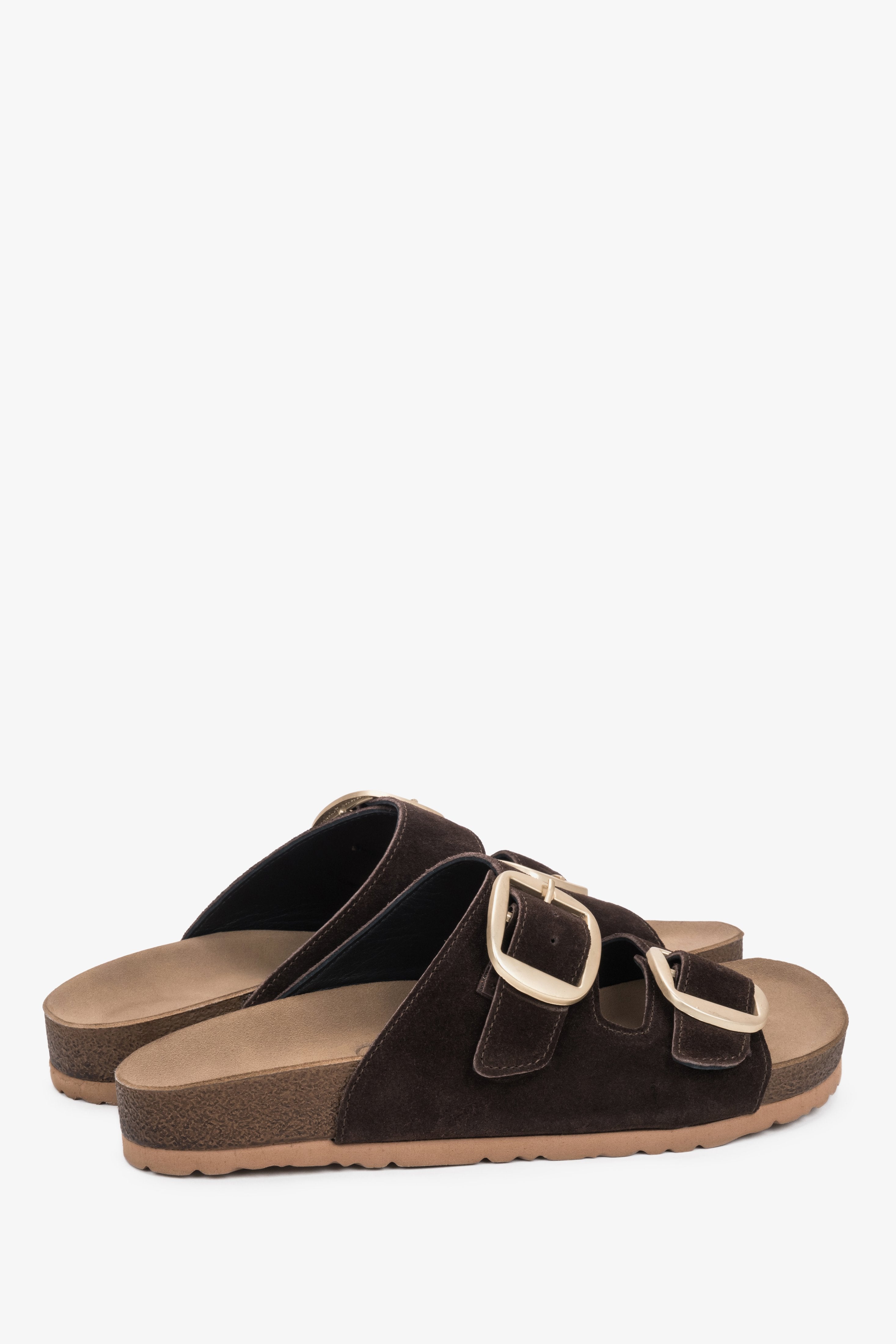 The back of the shoe showing the stable sole construction and the precise edge finishing of the premium natural suede.