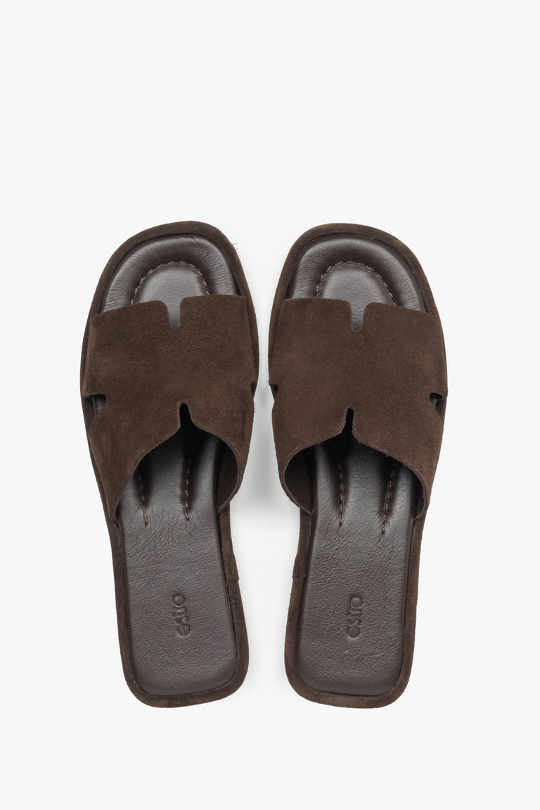 View of a pair of shoes featuring a closed toe with elegant cut-out details and a smooth leather insole finished with a subtle brand logo.