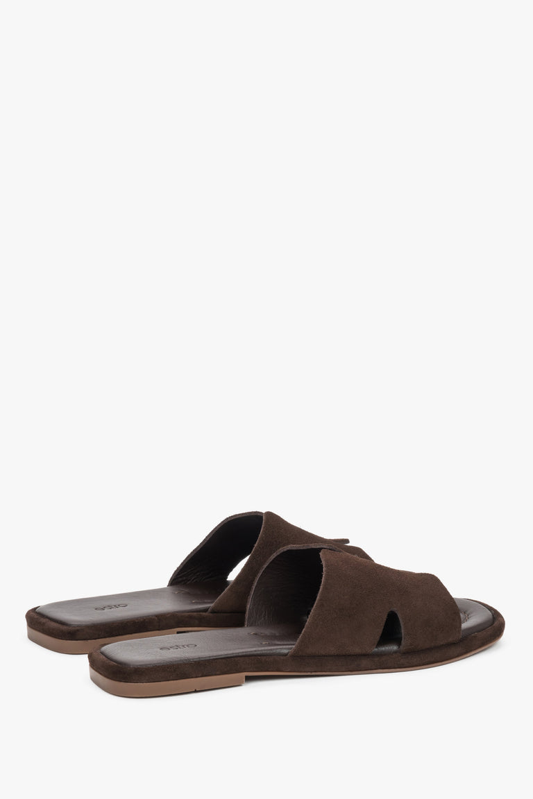 Rear view of the mules showcasing an open-heel design and precisely finished edges of the luxurious dark brown velour.