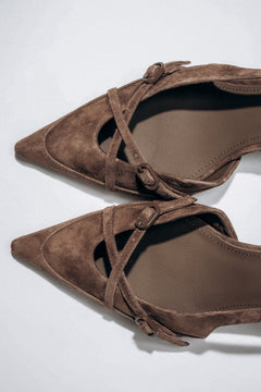 Detail view of crossing straps on dark brown velour slingback heels