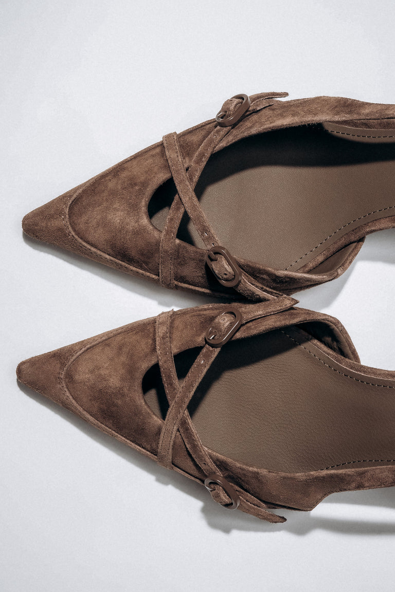 Detail view of crossing straps on dark brown velour slingback heels