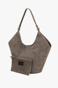 Dark grey hobo bag with comfortable shoulder handle and included small cosmetic pouch, blending elegance and functionality for modern living.