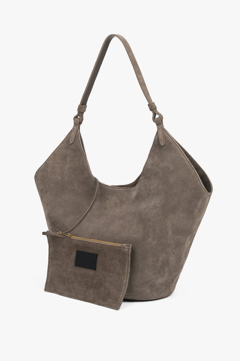 Dark grey hobo bag with comfortable shoulder handle and included small cosmetic pouch, blending elegance and functionality for modern living.