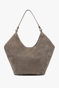 Sleek and spacious, this Estro hobo bag in grey velour combines luxury material with practical design, perfect for daily wear.