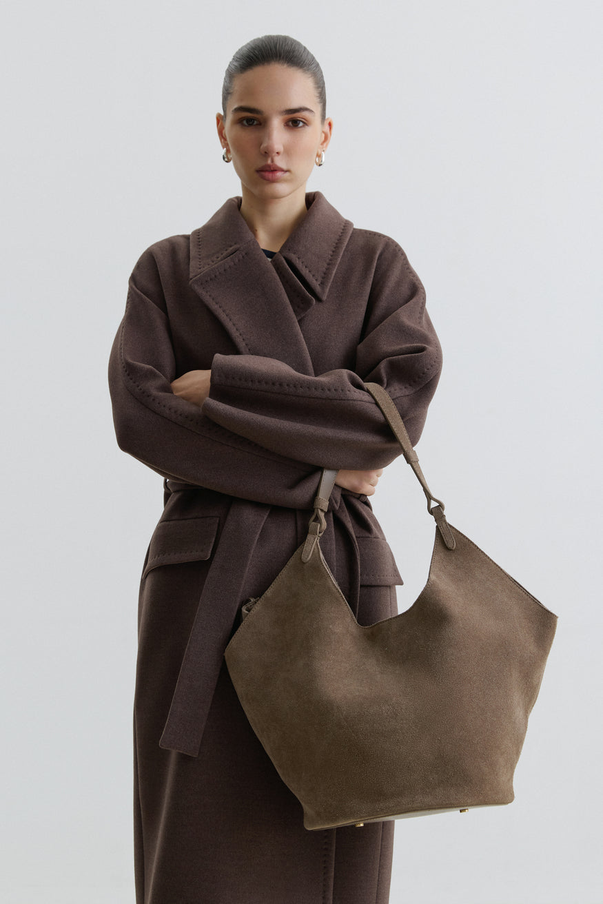 Dark grey hobo bag made from soft, premium Italian velour, featuring a relaxed silhouette and elegant magnetic closure for everyday style.