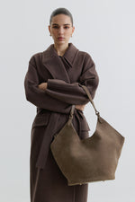 Dark grey hobo bag made from soft, premium Italian velour, featuring a relaxed silhouette and elegant magnetic closure for everyday style.